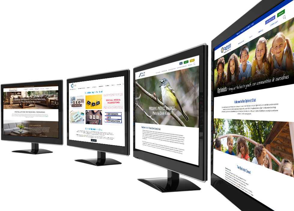Four desktop computer monitors arranged in a diagonal row, each displaying a different website homepage design.